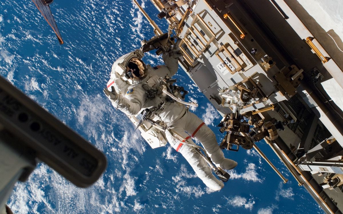 International Space Station astronauts under repair